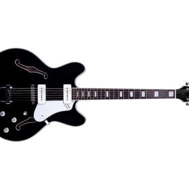 front of black VOX electric guitar